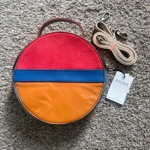 Soruka round leather purse.